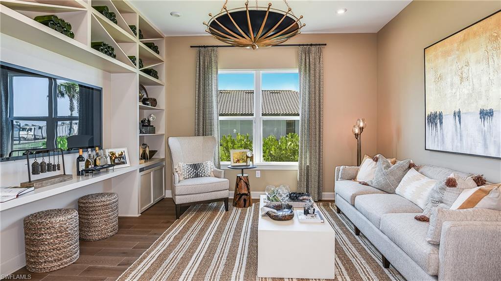 15680 Cassio Way Naples, FL 34114 - Photo 13 of 36 a living room with furniture and a large window