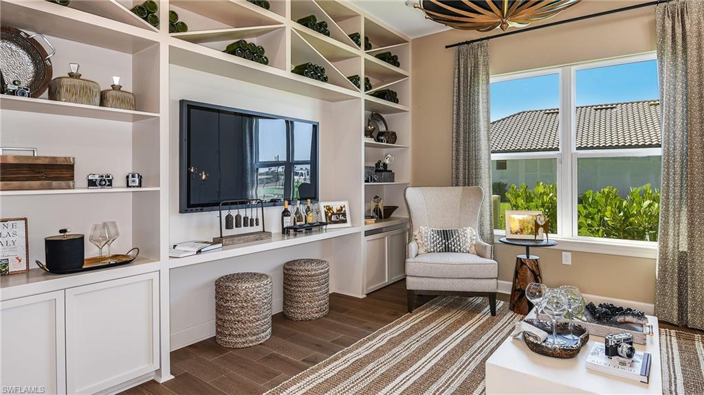 15680 Cassio Way Naples, FL 34114 - Photo 15 of 36 a living room with furniture and a large window