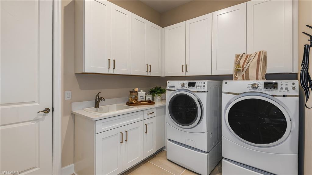 15680 Cassio Way Naples, FL 34114 - Photo 18 of 36 a utility room with sink dryer and washer