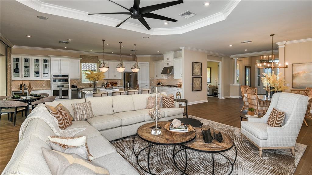 15680 Cassio Way Naples, FL 34114 - Photo 20 of 36 a living room with furniture and a wooden floor