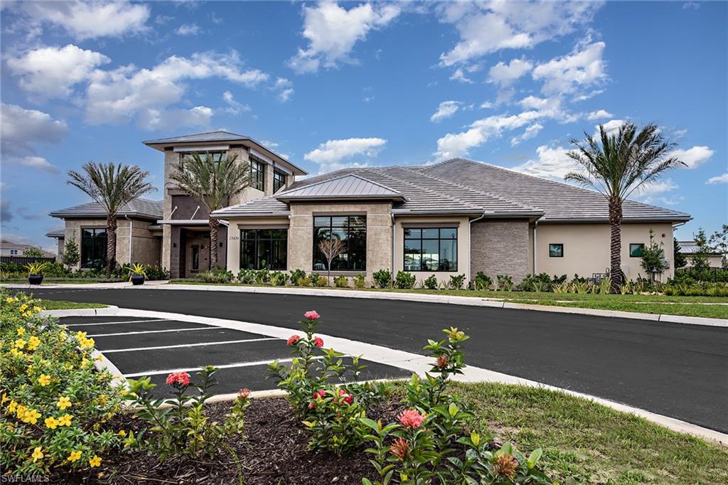 15680 Cassio Way Naples, FL 34114 - Photo 26 of 36 a front view of house with yard and green space