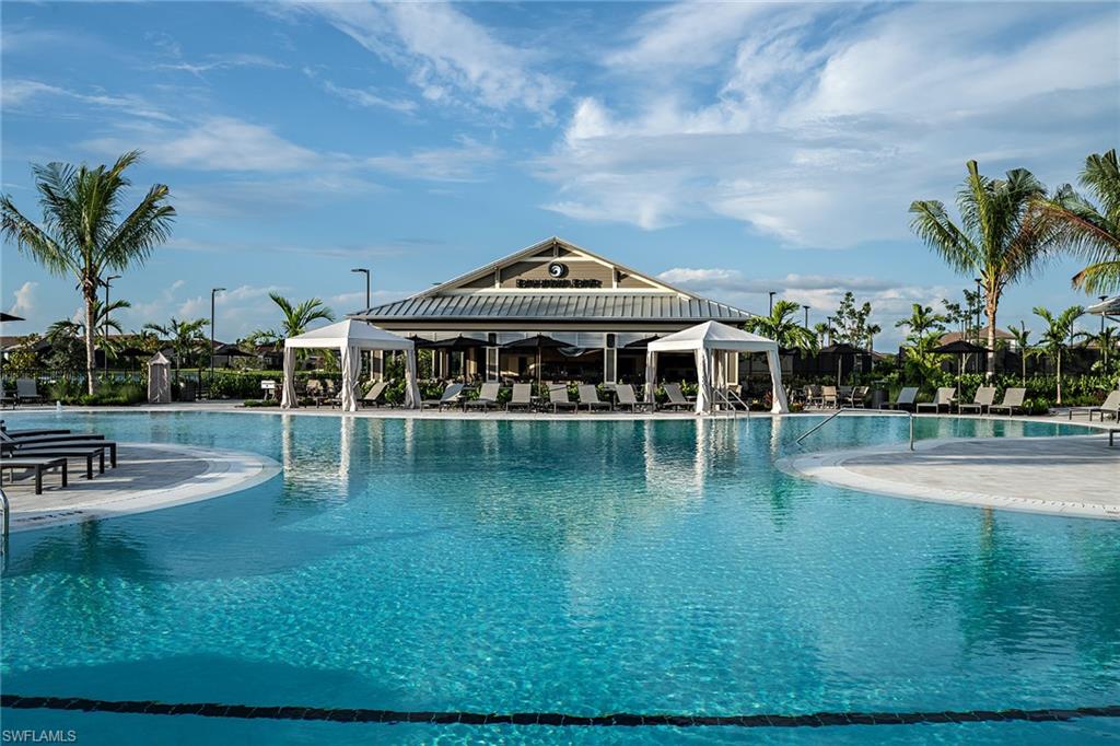15680 Cassio Way Naples, FL 34114 - Photo 31 of 36 a view of a swimming pool with an outdoor seating