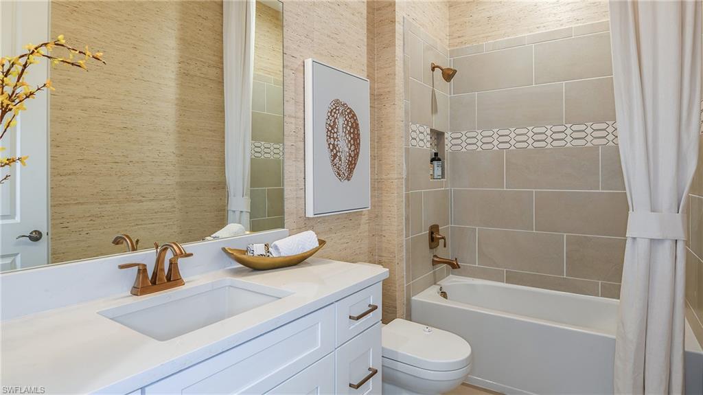 15680 Cassio Way Naples, FL 34114 - Photo 8 of 36 a bathroom with a sink toilet tub and shower
