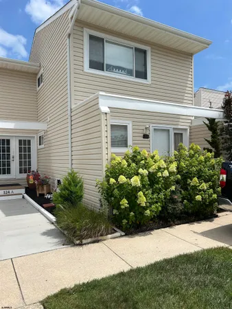 a bunch of flowers in front of house