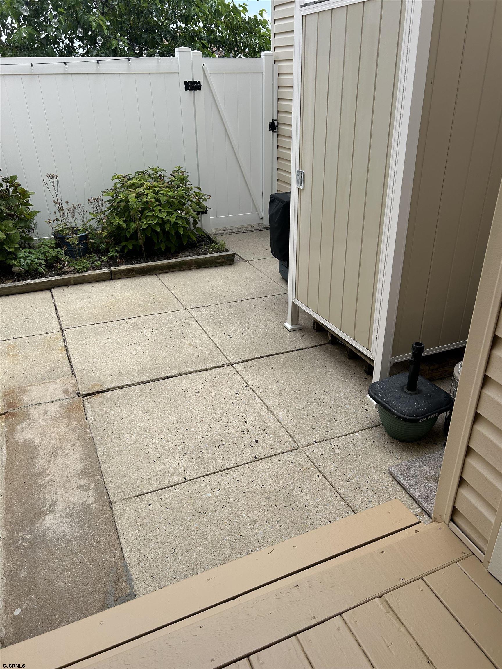 124 44th Street South, Unit B Brigantine, NJ 08203 - Photo 11 of 13 a view of a terrace with wooden cabinet