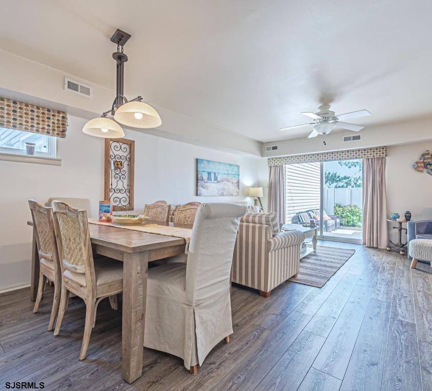 124 44th Street South, Unit B Brigantine, NJ 08203 - Photo 6 of 13 a view of a dining room with furniture window and wooden floor