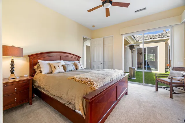 a bedroom with a bed and a table