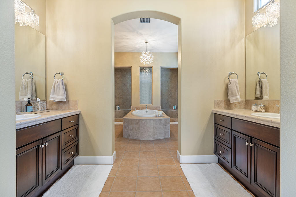 56825 Mountain View La Quinta, CA 92253 - Photo 21 of 30 a bathroom with a double vanity sink and a mirror