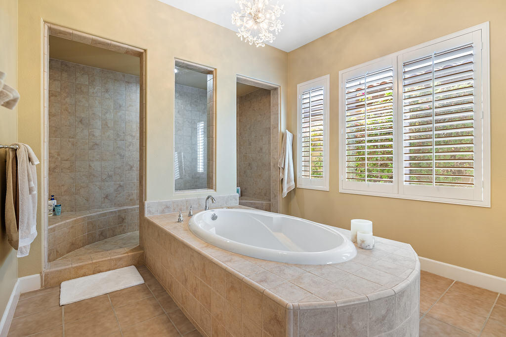 56825 Mountain View La Quinta, CA 92253 - Photo 22 of 30 a bath tub sitting in a bathroom next to a window