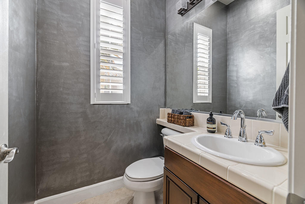 56825 Mountain View La Quinta, CA 92253 - Photo 25 of 30 a bathroom with a sink toilet and a mirror