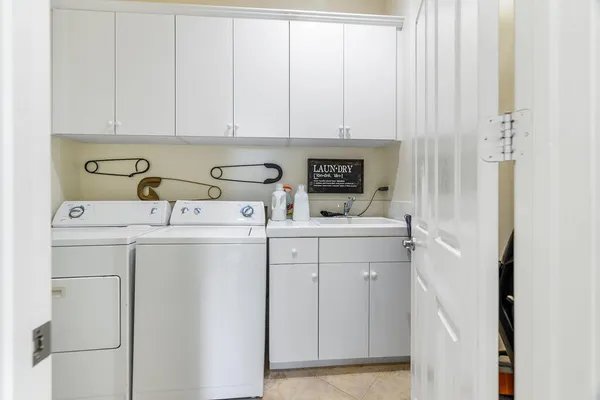 a utility room with dryer and washer