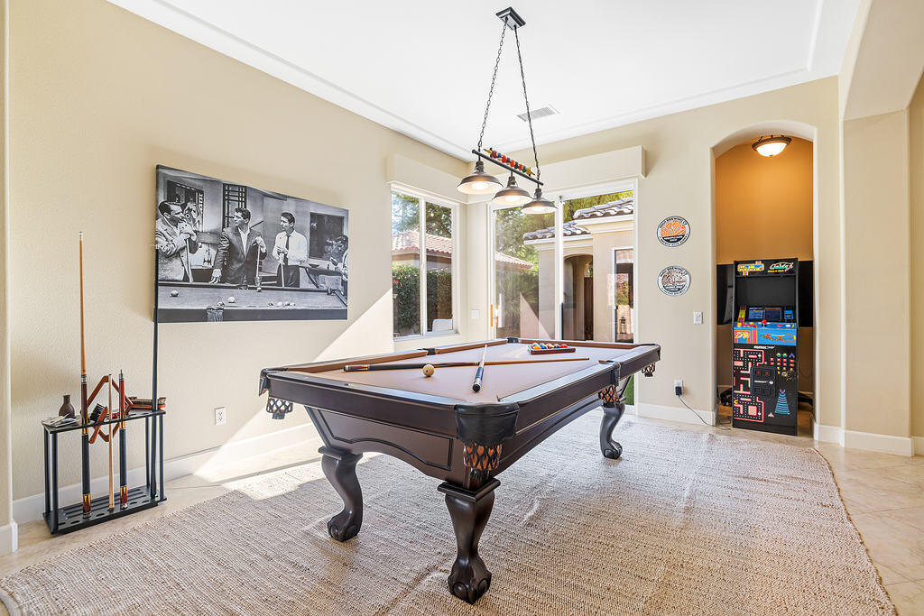 56825 Mountain View La Quinta, CA 92253 - Photo 27 of 30 a room with chandelier fan and wooden floor