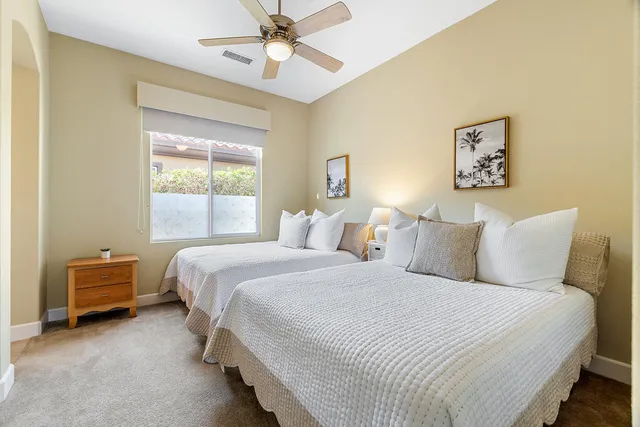 a bedroom with bed and window