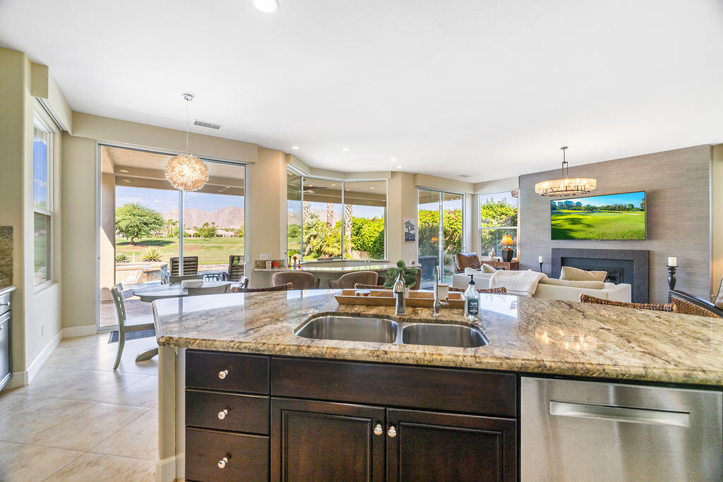 56825 Mountain View La Quinta, CA 92253 - Photo 9 of 30 a kitchen with granite countertop a sink and a counter top space