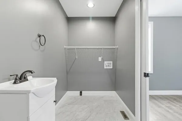 a bathroom with a sink and shower