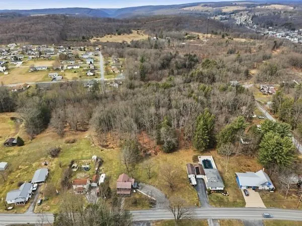 an aerial view of residential house with beach