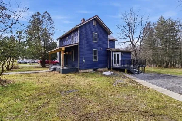 a view of a house with a yard
