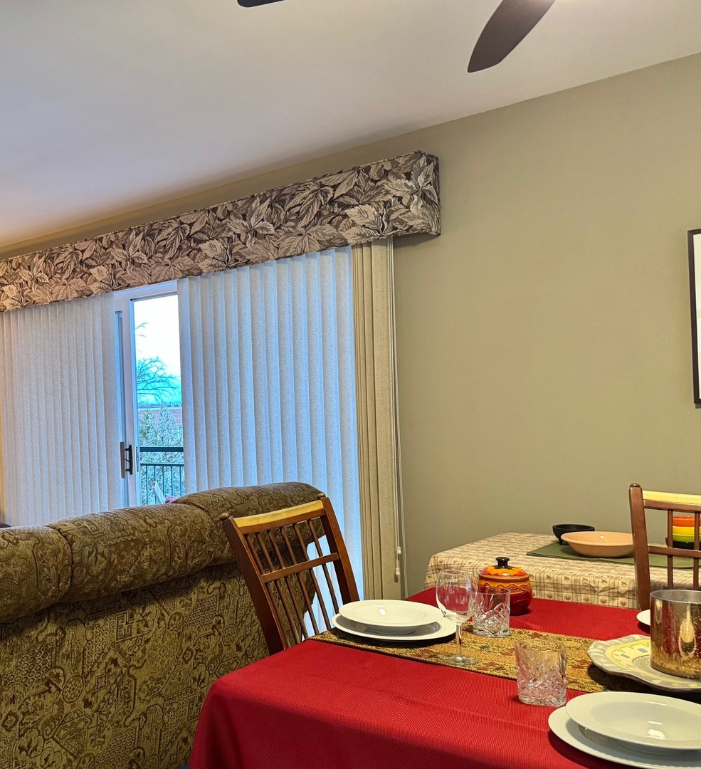 1325 Perry Street, Unit 606 Des Plaines, IL 60016 - Photo 10 of 25 a bedroom with a bed and a wooden floor