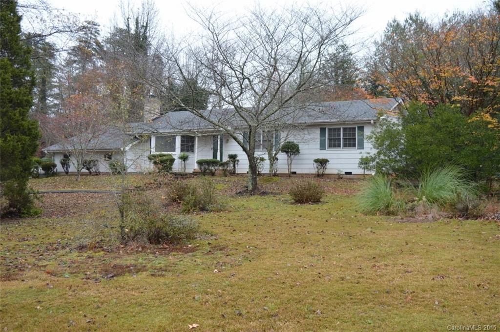 981 Red Fox Road, Unit 4 Columbus, NC 28722 - Photo 1 of 4 a front view of a house with a yard