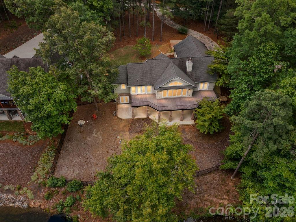 338 PLANTATION Way Mount Gilead, NC 27306 - Photo 3 of 48 an aerial view of a house with a garden