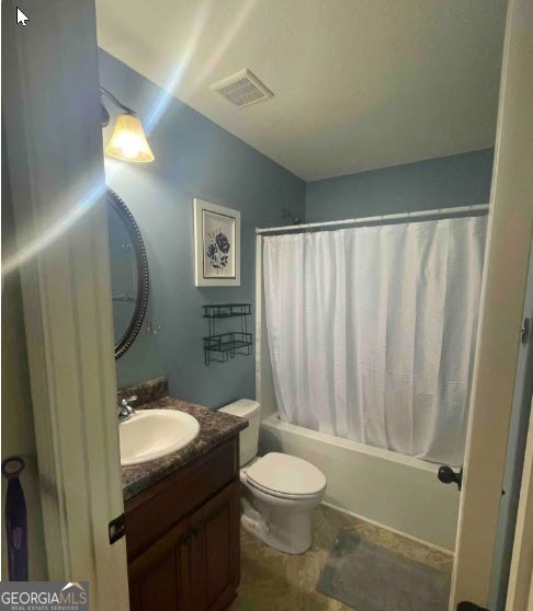 308 Haven Way Perry, GA 31069 - Photo 16 of 17 a bathroom with a granite countertop toilet sink and mirror