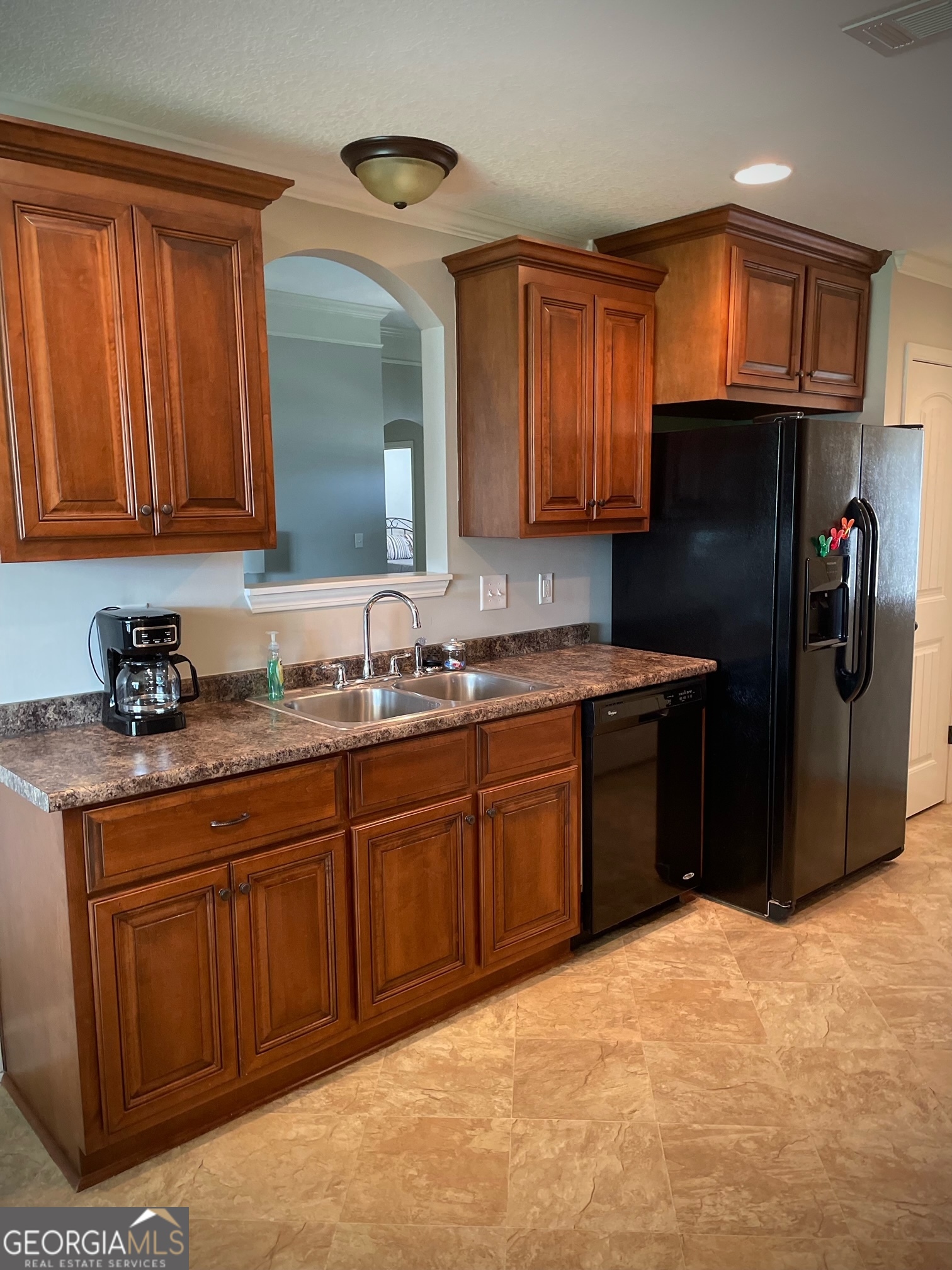 308 Haven Way Perry, GA 31069 - Photo 5 of 17 a kitchen with stainless steel appliances granite countertop a refrigerator and a sink