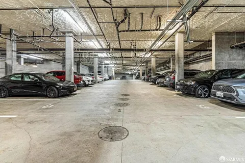 a view of parking garage with cars