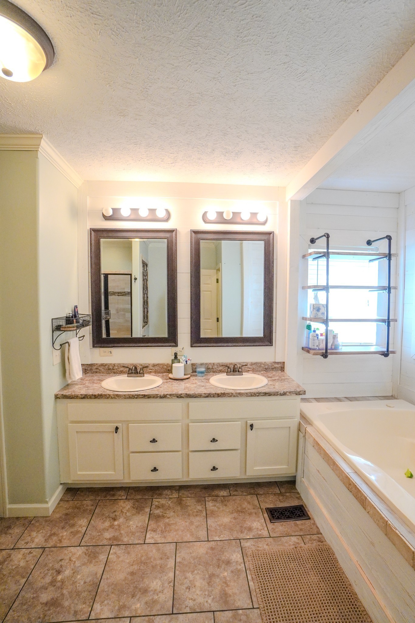 137 Hawkins Road Westmoreland, TN 37186 - Photo 52 of 71 a bathroom with a granite countertop sink mirror and bathtub
