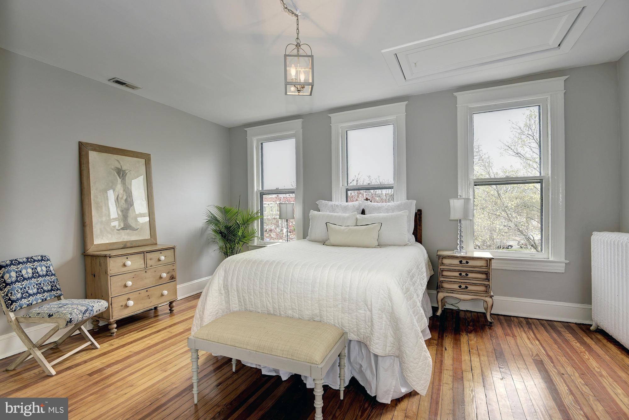 1351 A Street Northeast Washington, DC 20002 - Photo 14 of 26 a bedroom with a bed and wooden floor