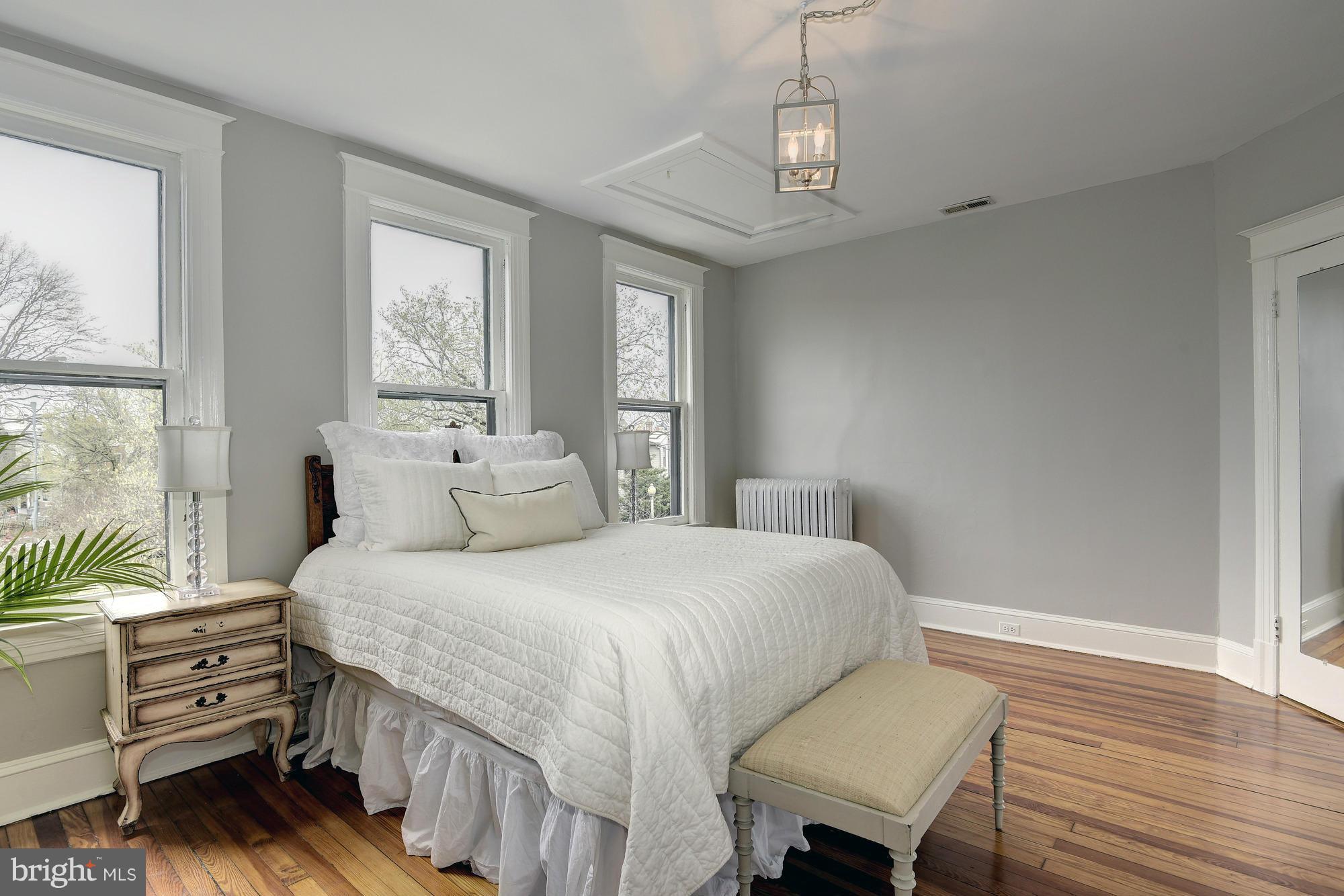 1351 A Street Northeast Washington, DC 20002 - Photo 15 of 26 a bedroom with a bed and wooden floor
