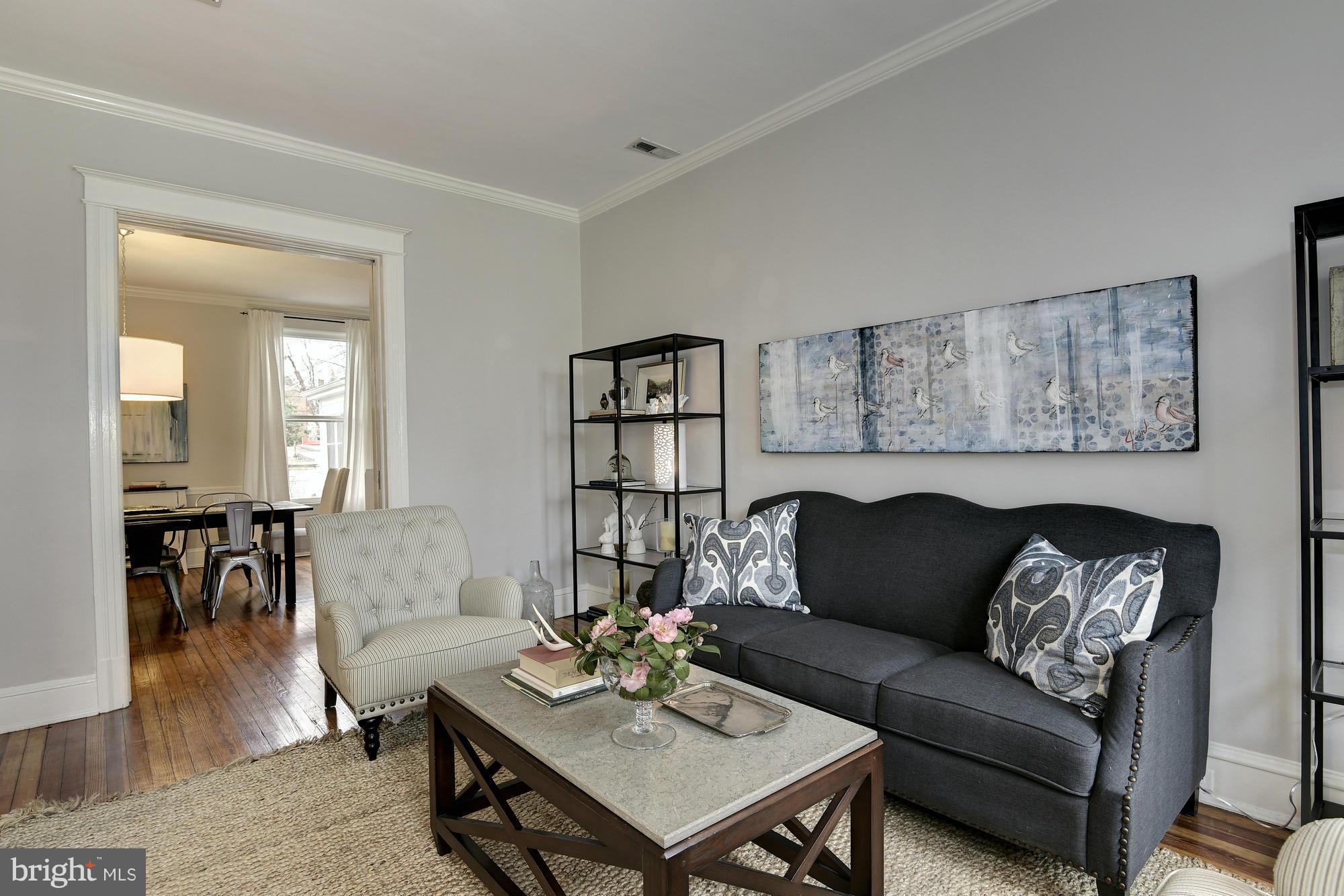 1351 A Street Northeast Washington, DC 20002 - Photo 5 of 26 a living room with furniture and a wooden floor