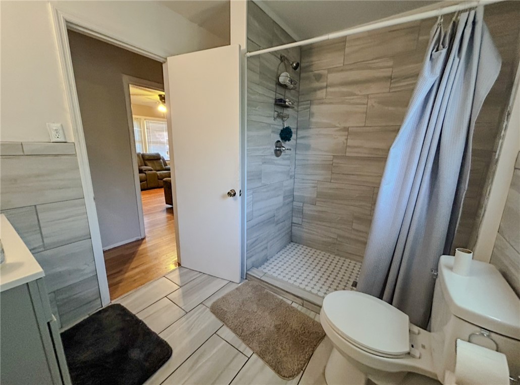206 Collingwood Drive Anderson, SC 29621 - Photo 17 of 23 This bright bathroom features tile flooring, a walk-in shower, and an inviting ambiance.