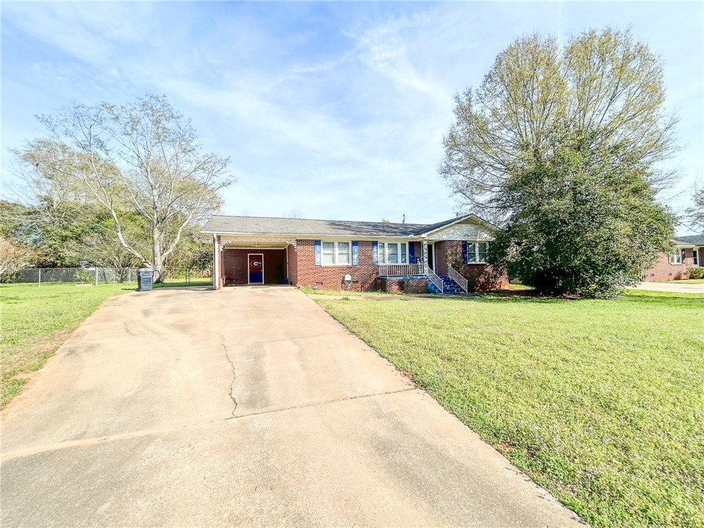 206 Collingwood Drive Anderson, SC 29621 - Photo 2 of 23 This charming brick home features a spacious front yard and convenient carport.