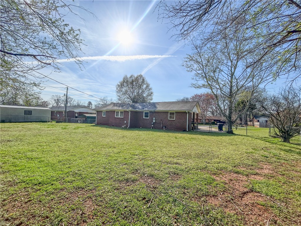 206 Collingwood Drive Anderson, SC 29621 - Photo 22 of 23 Expansive backyard with a lush lawn, ideal for outdoor activities and relaxation.