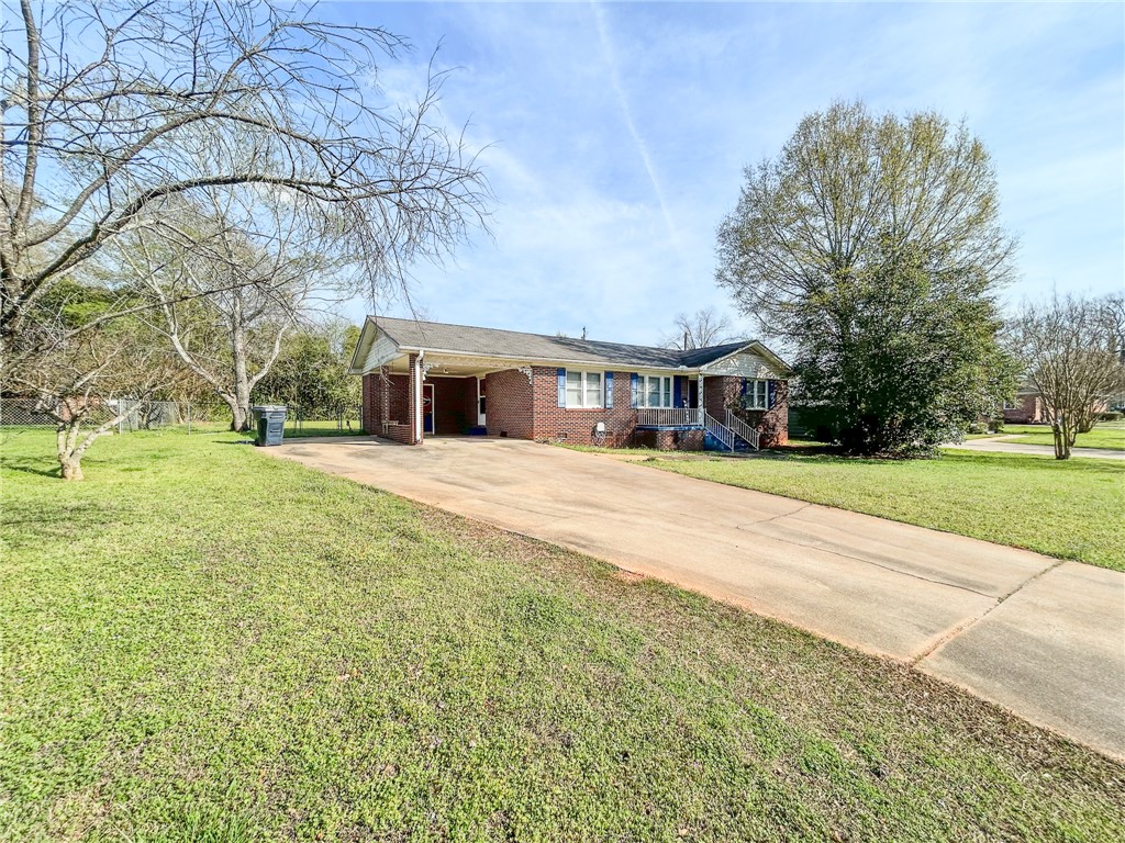 206 Collingwood Drive Anderson, SC 29621 - Photo 3 of 23 This charming brick residence offers ample outdoor space and a welcoming front entrance.