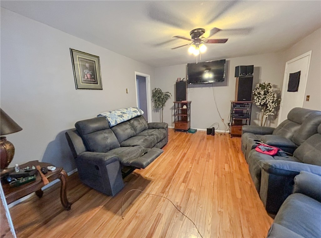 206 Collingwood Drive Anderson, SC 29621 - Photo 7 of 23 This inviting living area boasts rich hardwood flooring, creating a warm and welcoming atmosphere for relaxation.