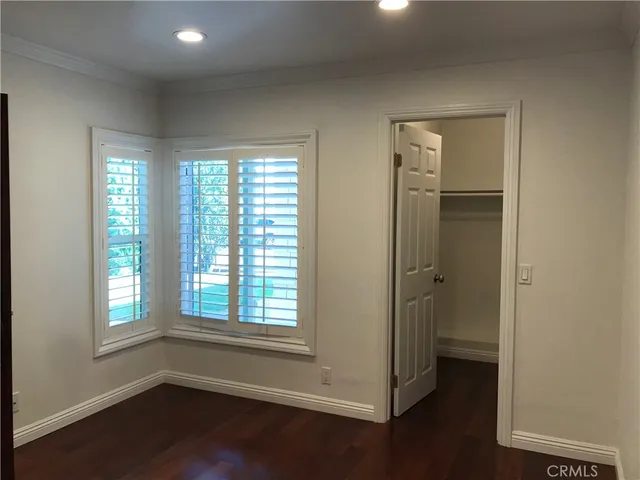 a view of entryway with window and wooden floor