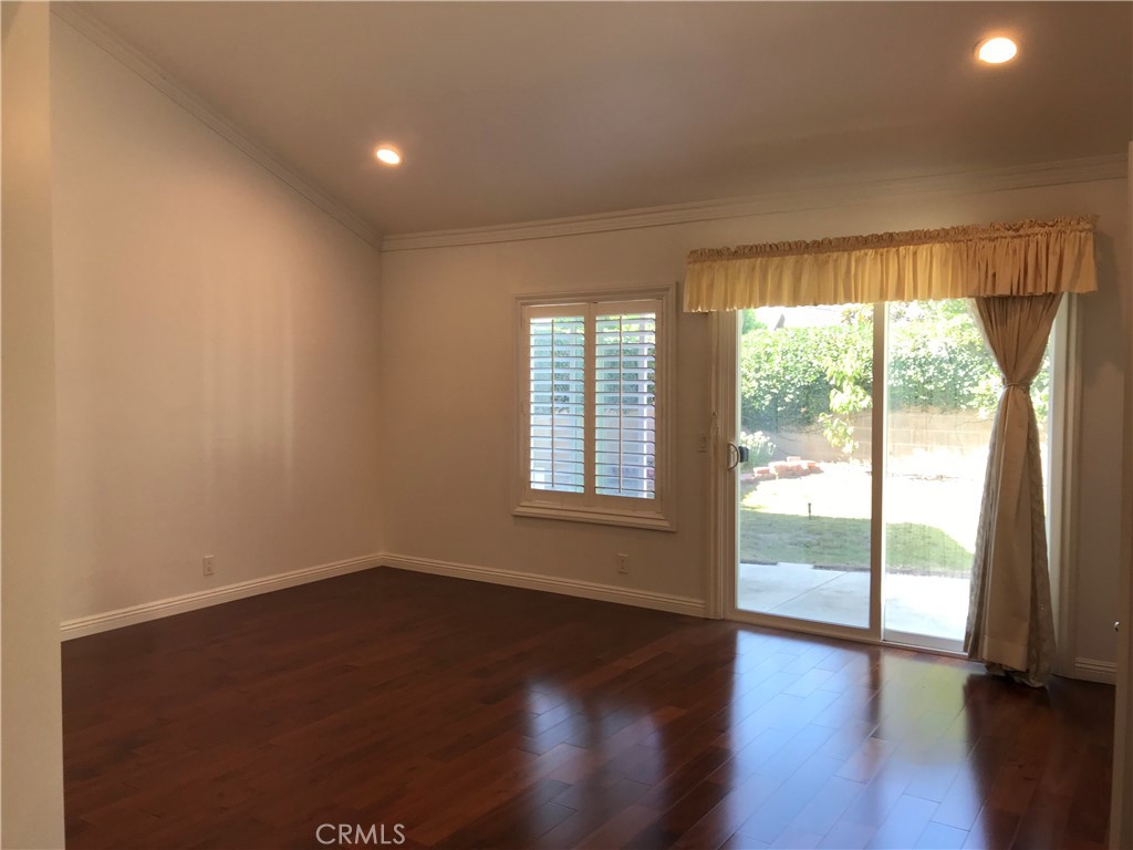 3 Morris Road Irvine, CA 92620 - Photo 12 of 24 an empty room with wooden floor and windows