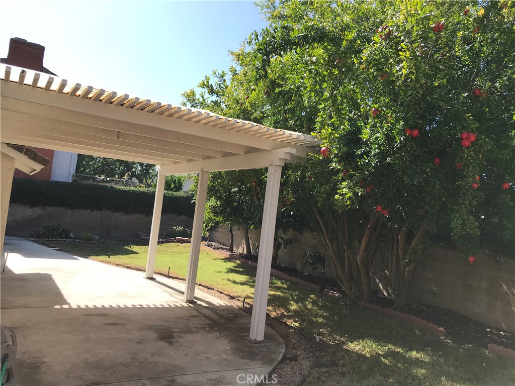 3 Morris Road Irvine, CA 92620 - Photo 20 of 24 a view of a patio with a table chairs and a backyard