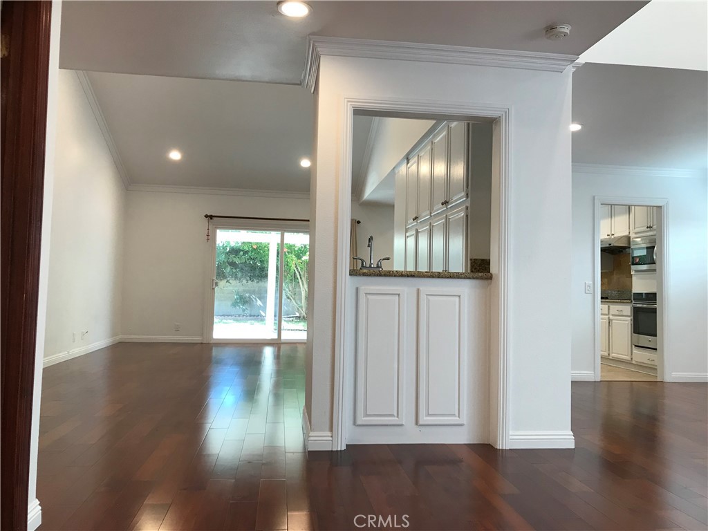 3 Morris Road Irvine, CA 92620 - Photo 3 of 24 a view of empty room with wooden floor and fan