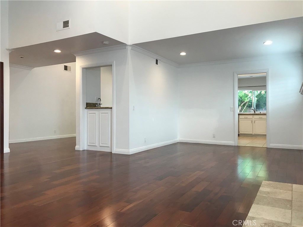 3 Morris Road Irvine, CA 92620 - Photo 10 of 24 an empty room with wooden floor and windows
