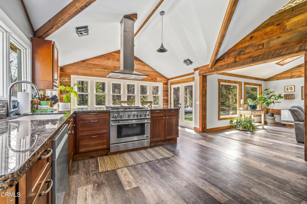 41912 Powers Road Mendocino, CA 95460 - Photo 12 of 48 a living room with stainless steel appliances kitchen island granite countertop a stove and a wooden floors