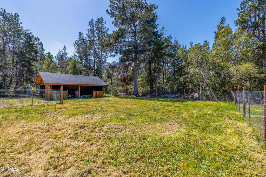 41912 Powers Road Mendocino, CA 95460 - Photo 45 of 48 front view of a house with a yard