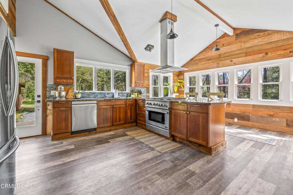 41912 Powers Road Mendocino, CA 95460 - Photo 7 of 48 a view of a kitchen with a sink and wooden floor