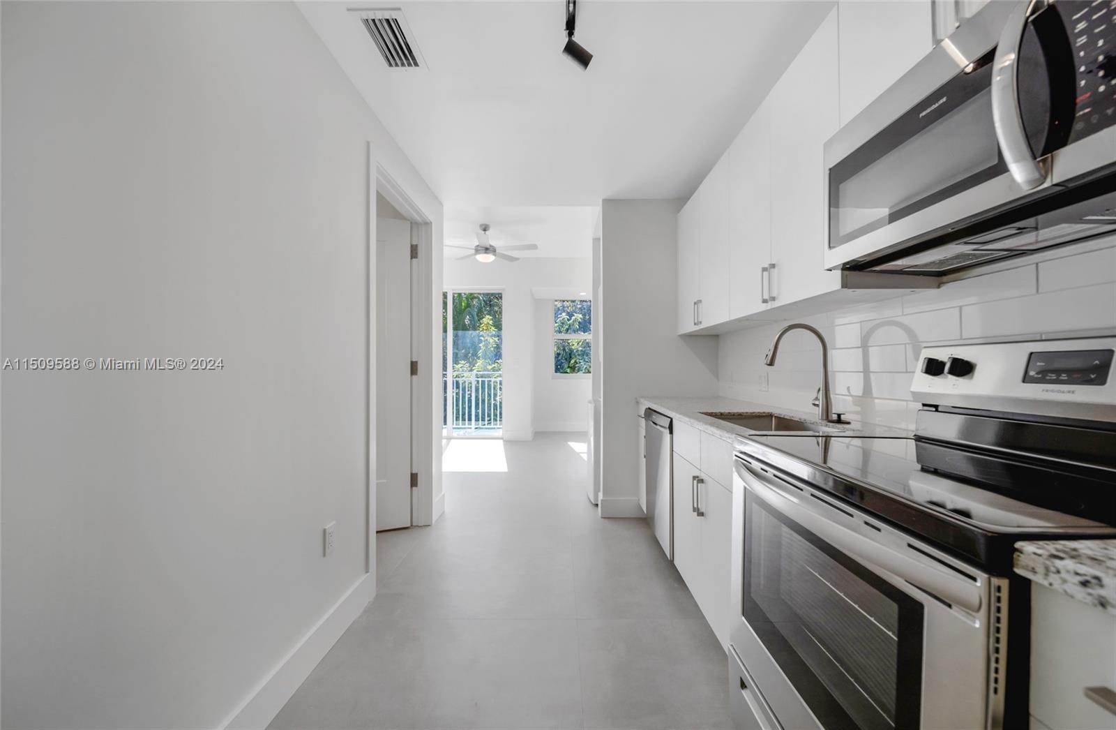 Civic Center Miami, FL 33125 - Photo 5 of 19 a kitchen with stainless steel appliances a sink stove and cabinets