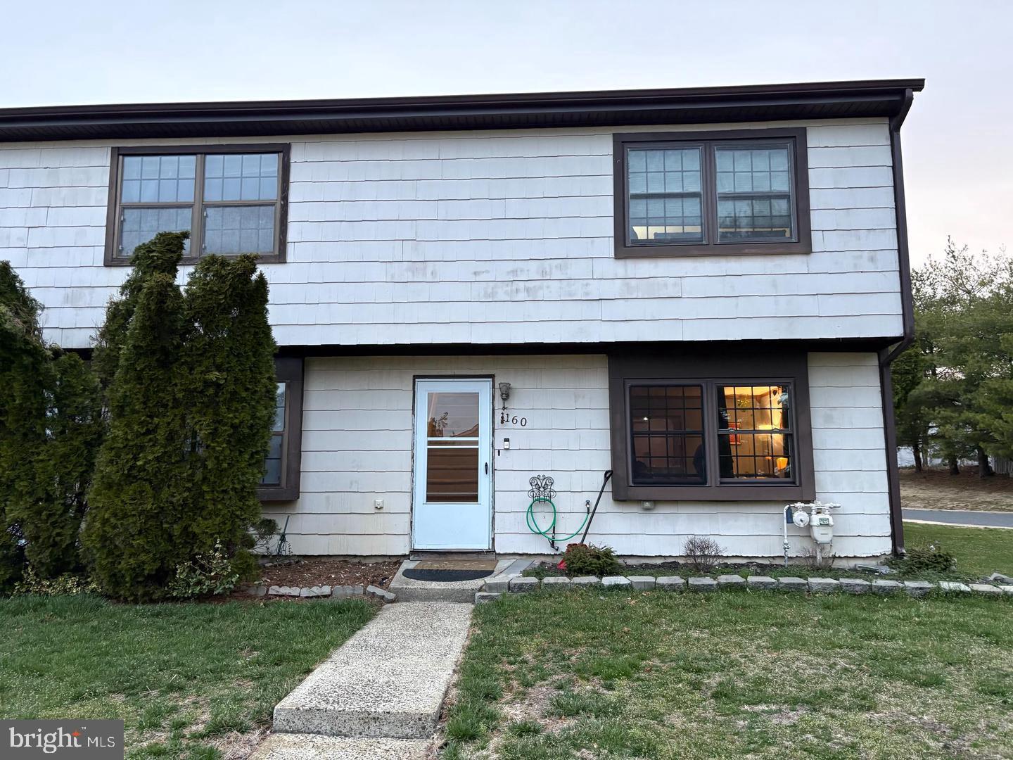 1160 Sawmill Road Brick, NJ 08724 - Photo 2 of 24 a front view of a house with a garden and garage