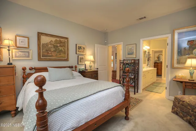 a bathroom with a sink a vanity a mirror and a bathtub