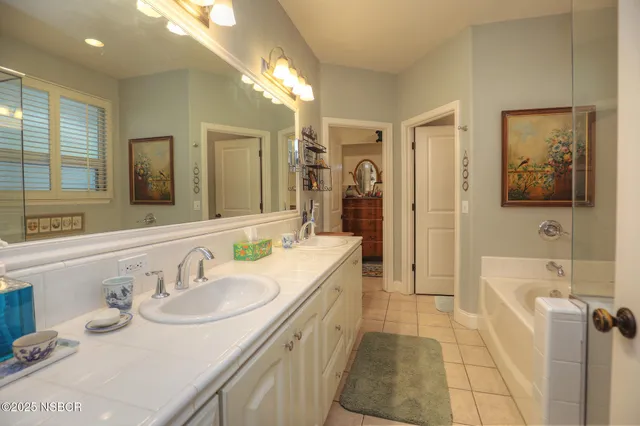 a bedroom with a bed and chair