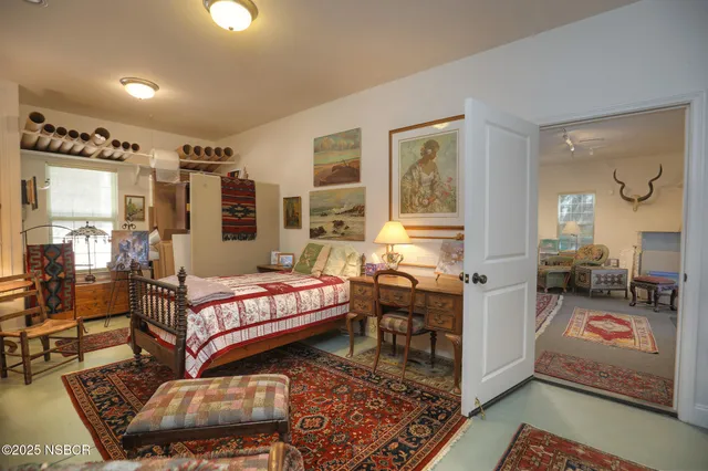 a living room with furniture or couch and a rug