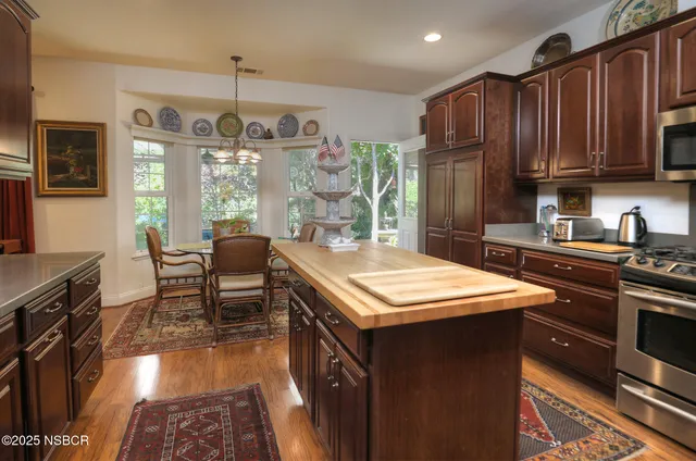 a view of a dining room with furniture window and outside view